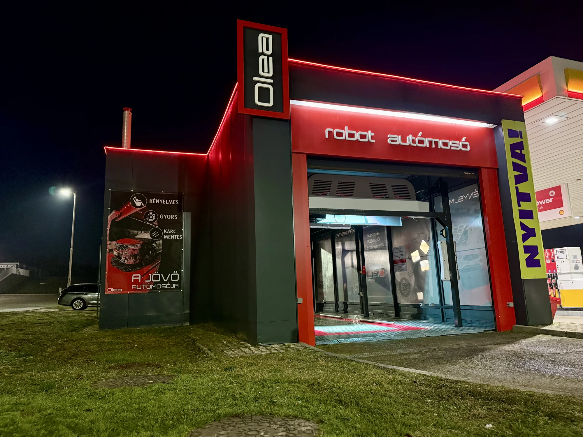 Completed OLEA robot wash with red night-time lighting